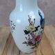 Asian vase decorated with peacock in porcelain