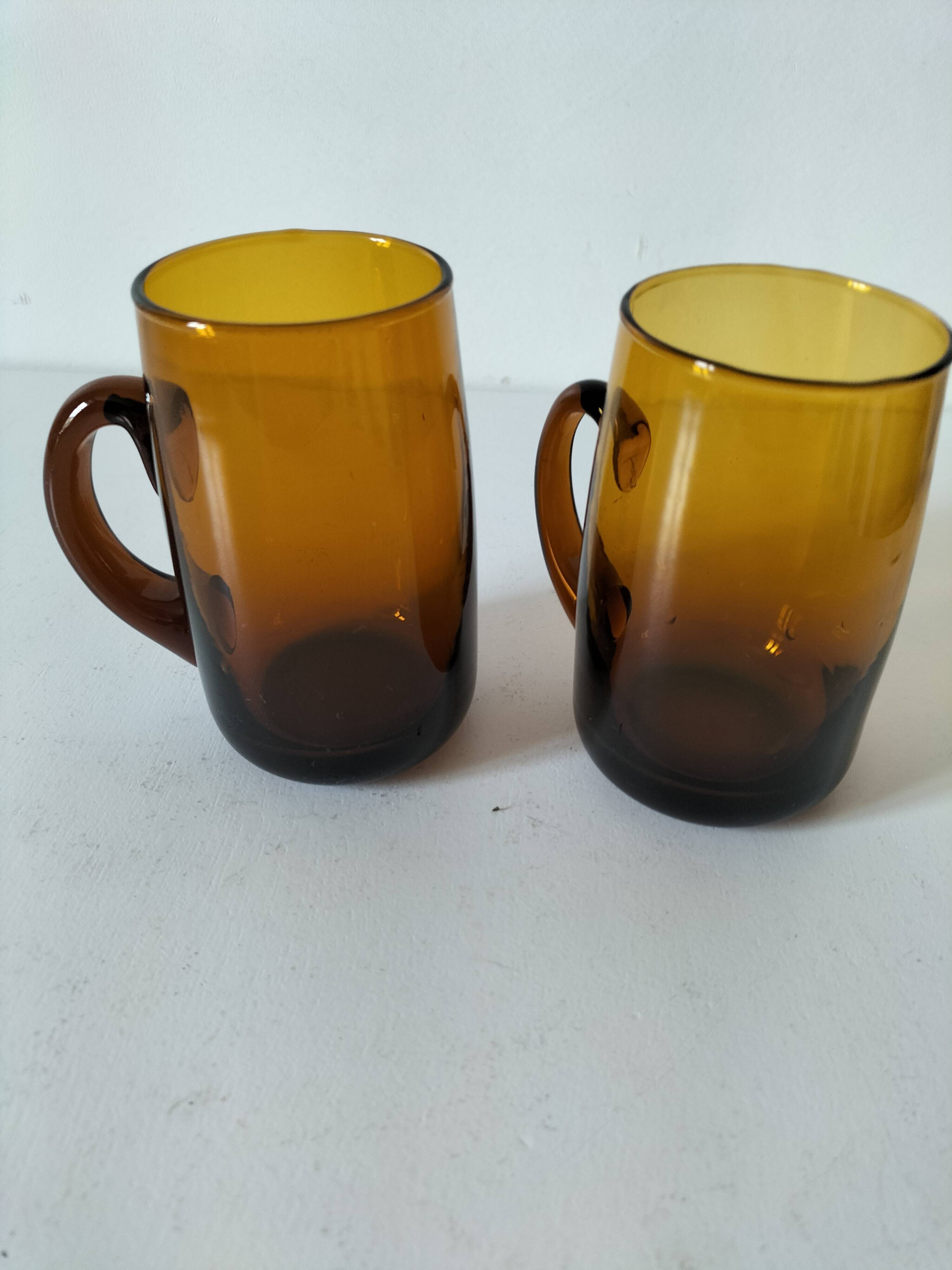 Pair of vintage amber glass tankards