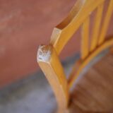 Set of 5 mismatched straw chairs.