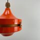 1970s orange Scandinavian suspension light in plexiglass shaped like a UFO.