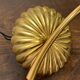 Gold metal wall light with ribbed glass.