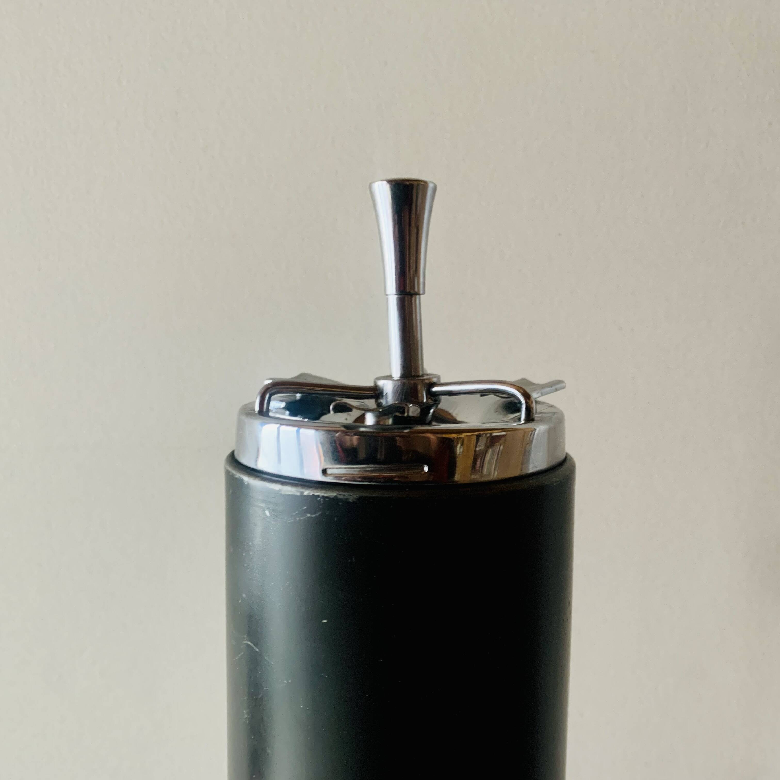 Vintage metal ashtray - push up