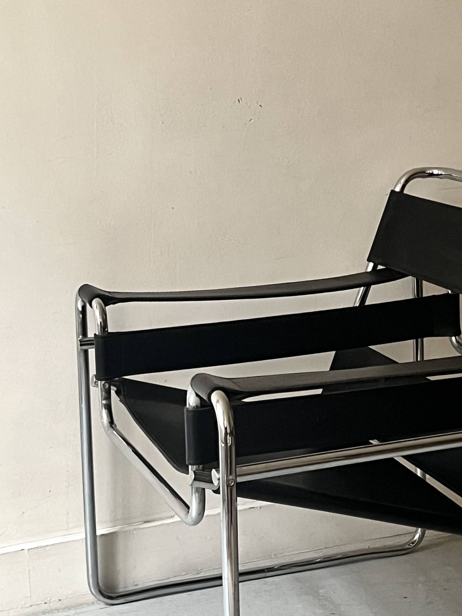 Wassily tubular armchair in chrome & black leather, designed by Marcel Breuer in 1970.