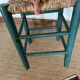 Vintage stool in green patinated wood and straw