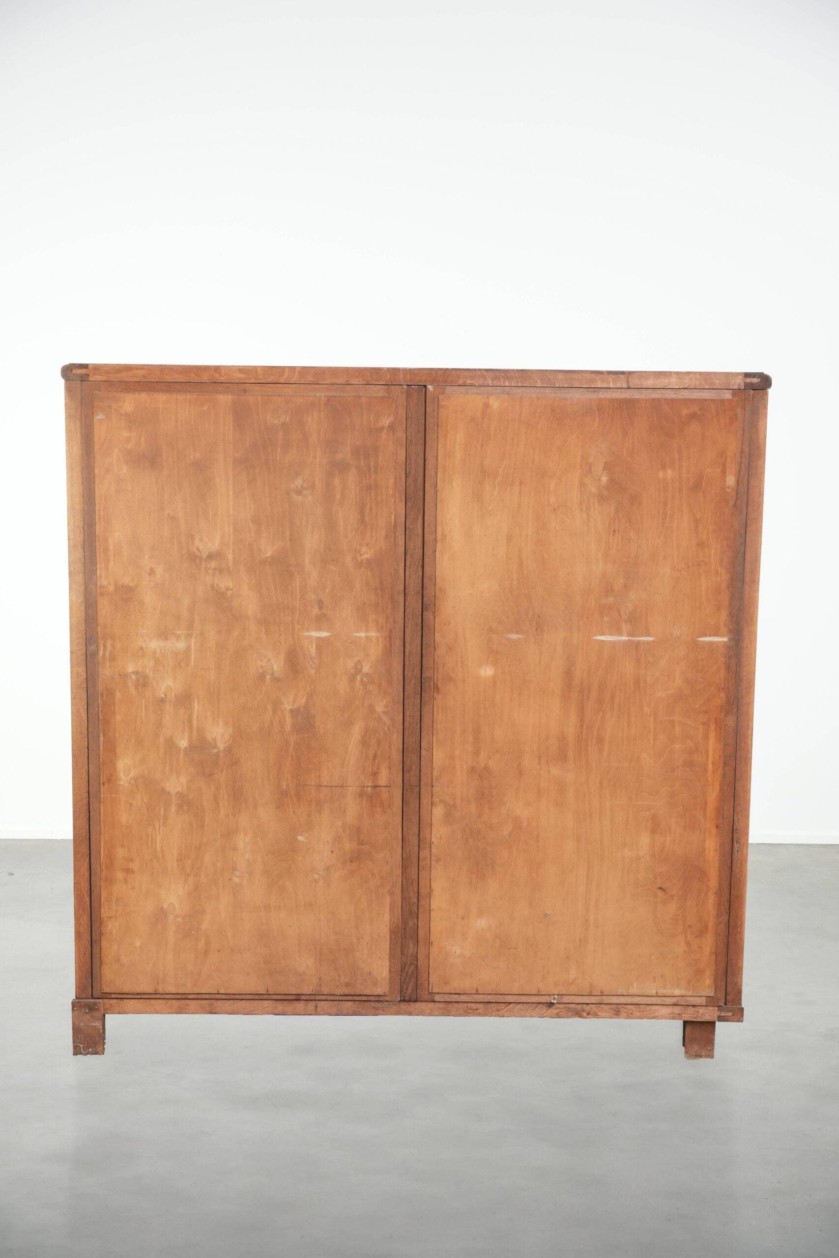Antique Dutch oak display cabinet with glass shelves and a mirrored back