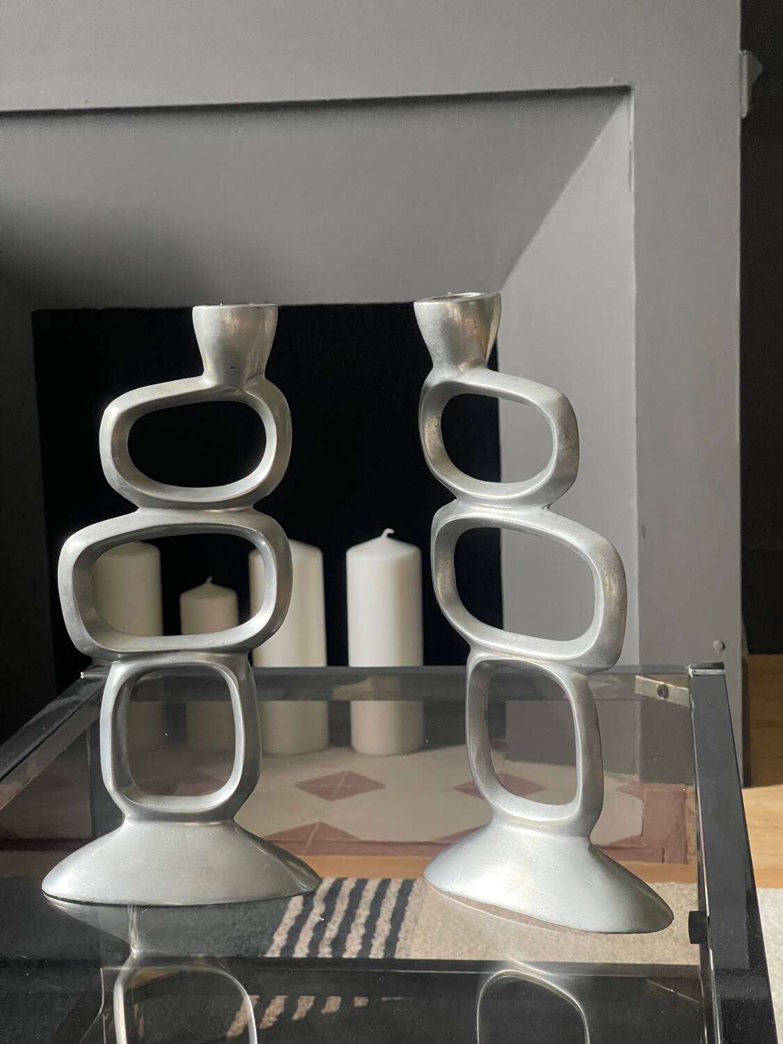 Pair of aluminum candlesticks
