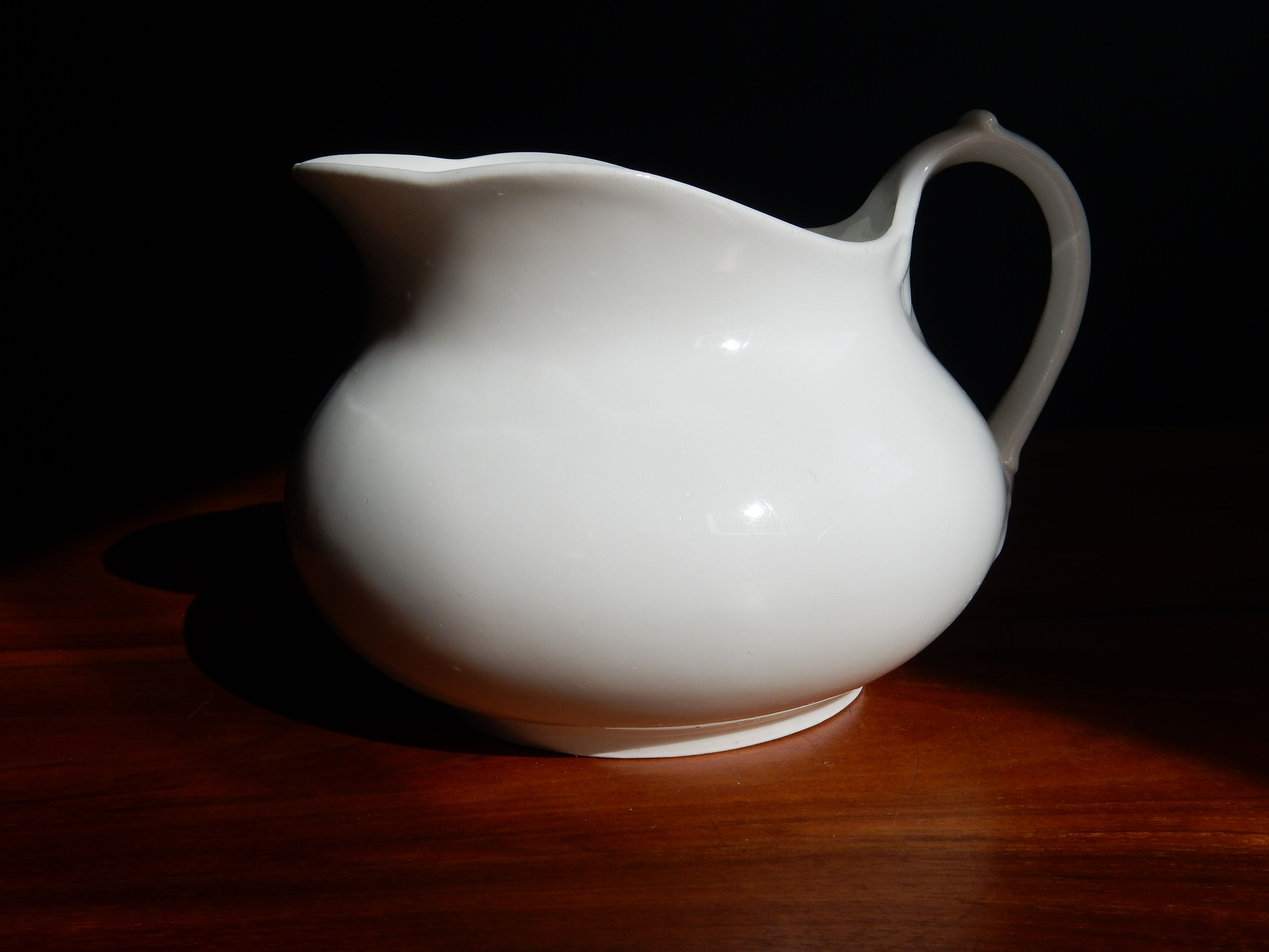 White ceramic water pitcher broc pot
