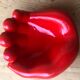 Empty pocket in the form of a red ceramic hand 60/70