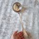 The Christofle silver-plated “Vendôme” cream ladle features a design