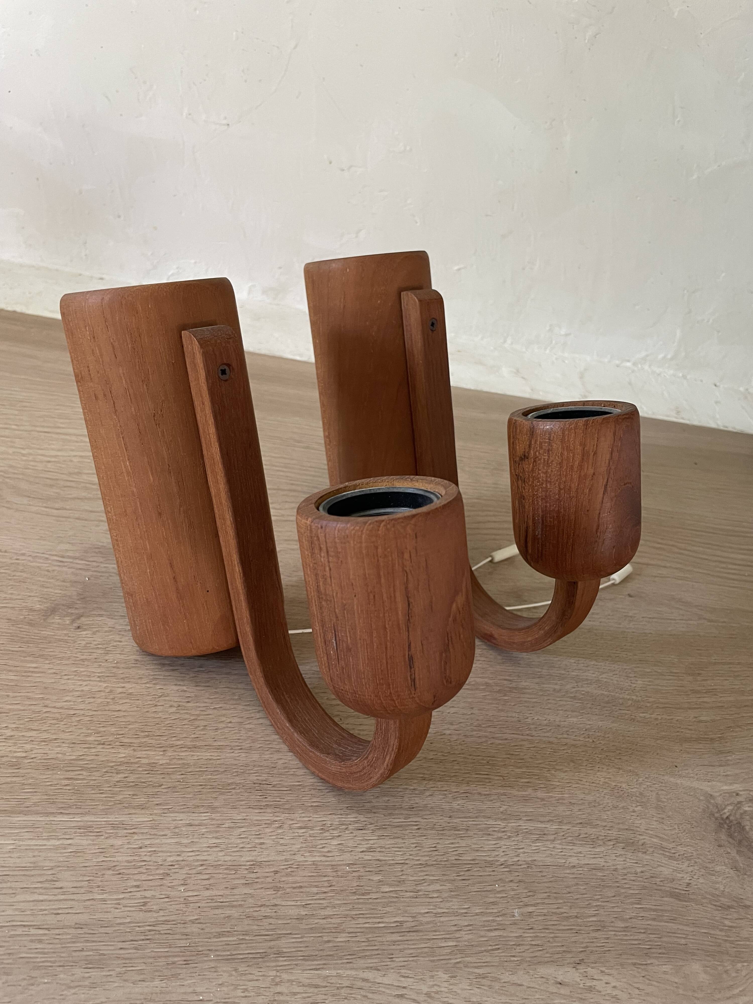 Pair of Scandinavian teak wall lights, Dolmus, 70s