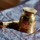 Mortar and its brass pestle with oriental gold and silver motifs