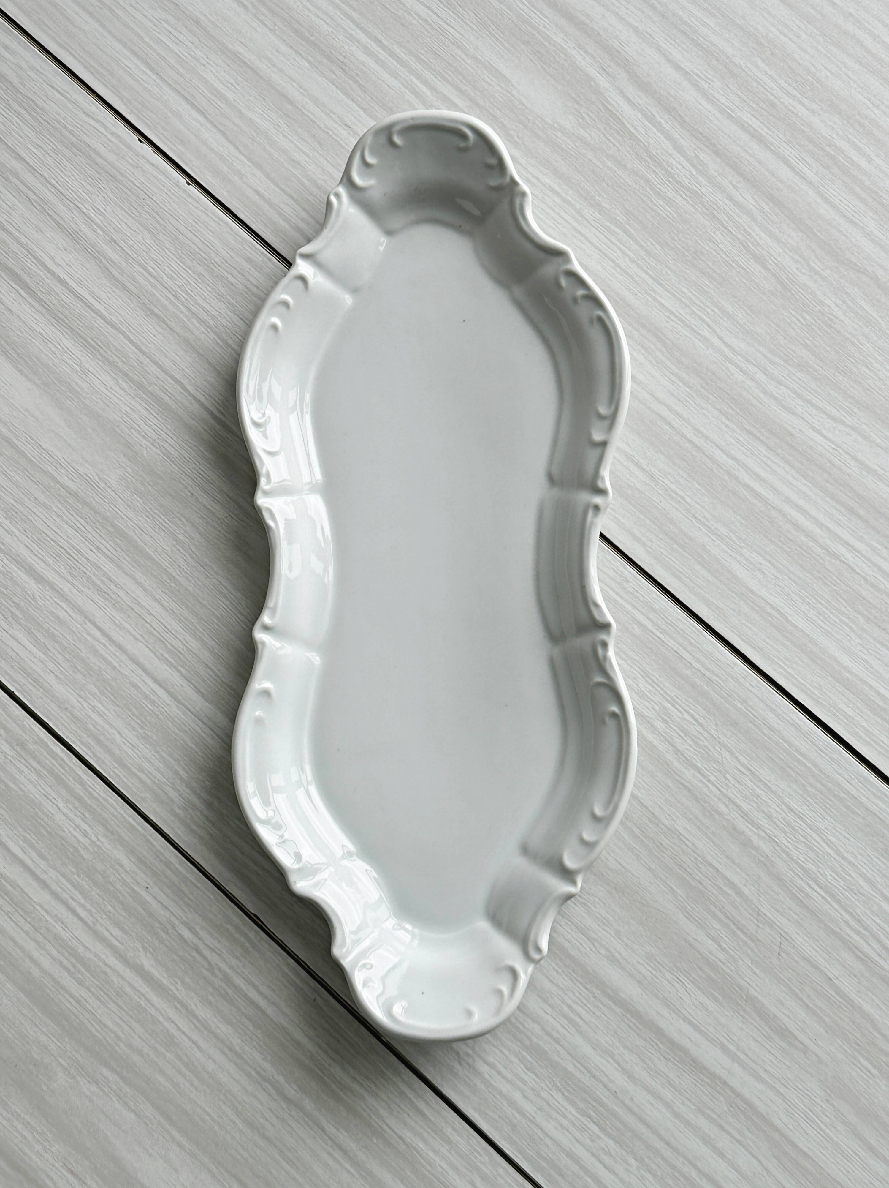 white porcelain plate in an unusual shape