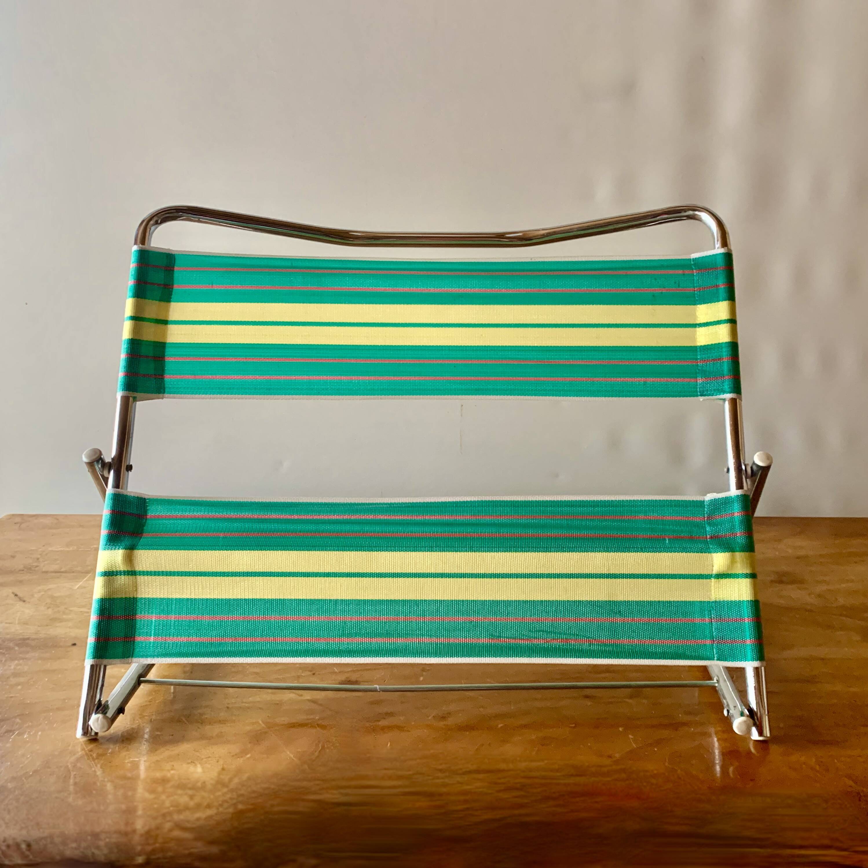 Vintage folding beach chair in chrome metal and woven plastic