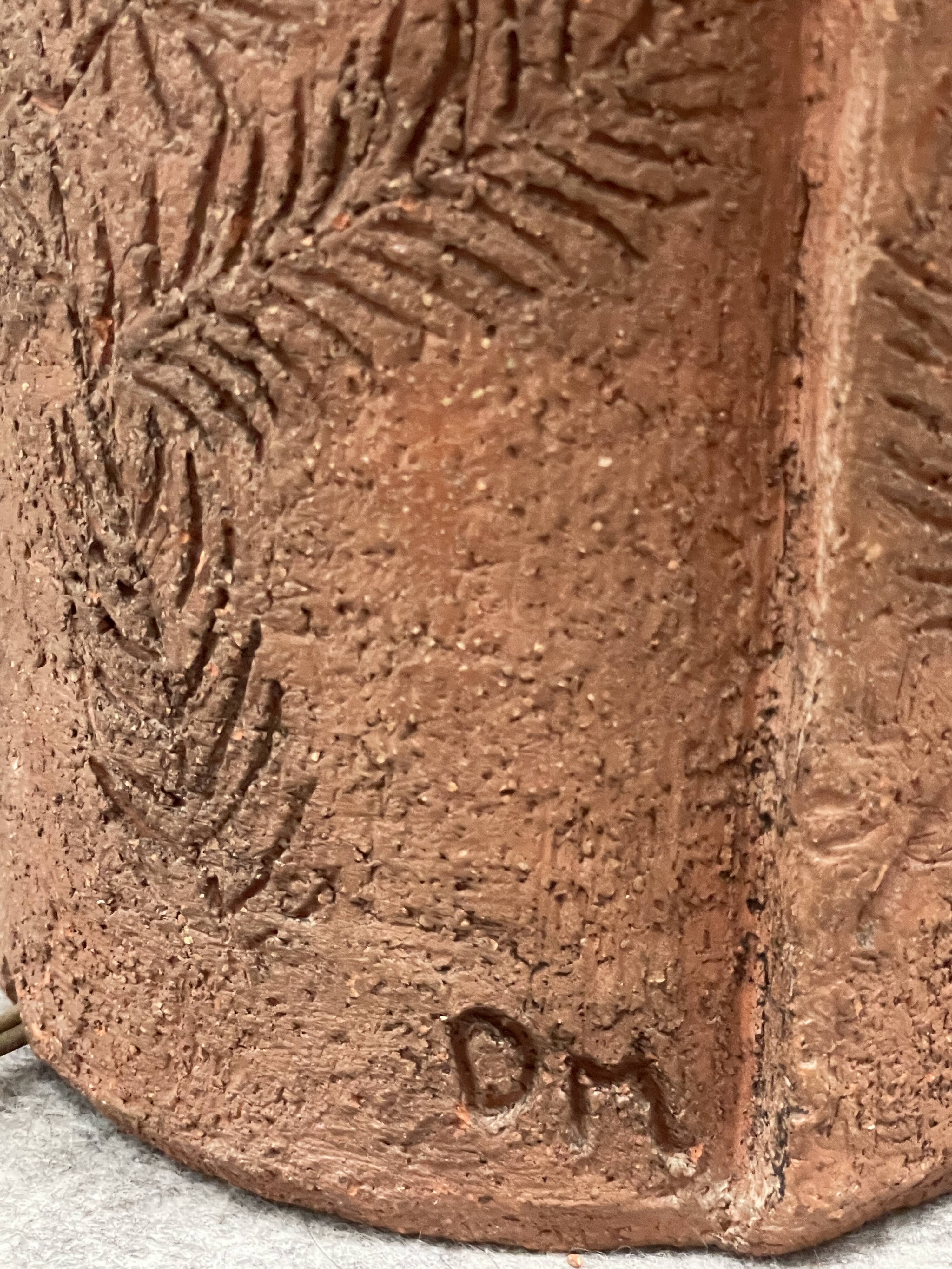 Large chamotte clay lamp in brutalist style, with a plant motif.