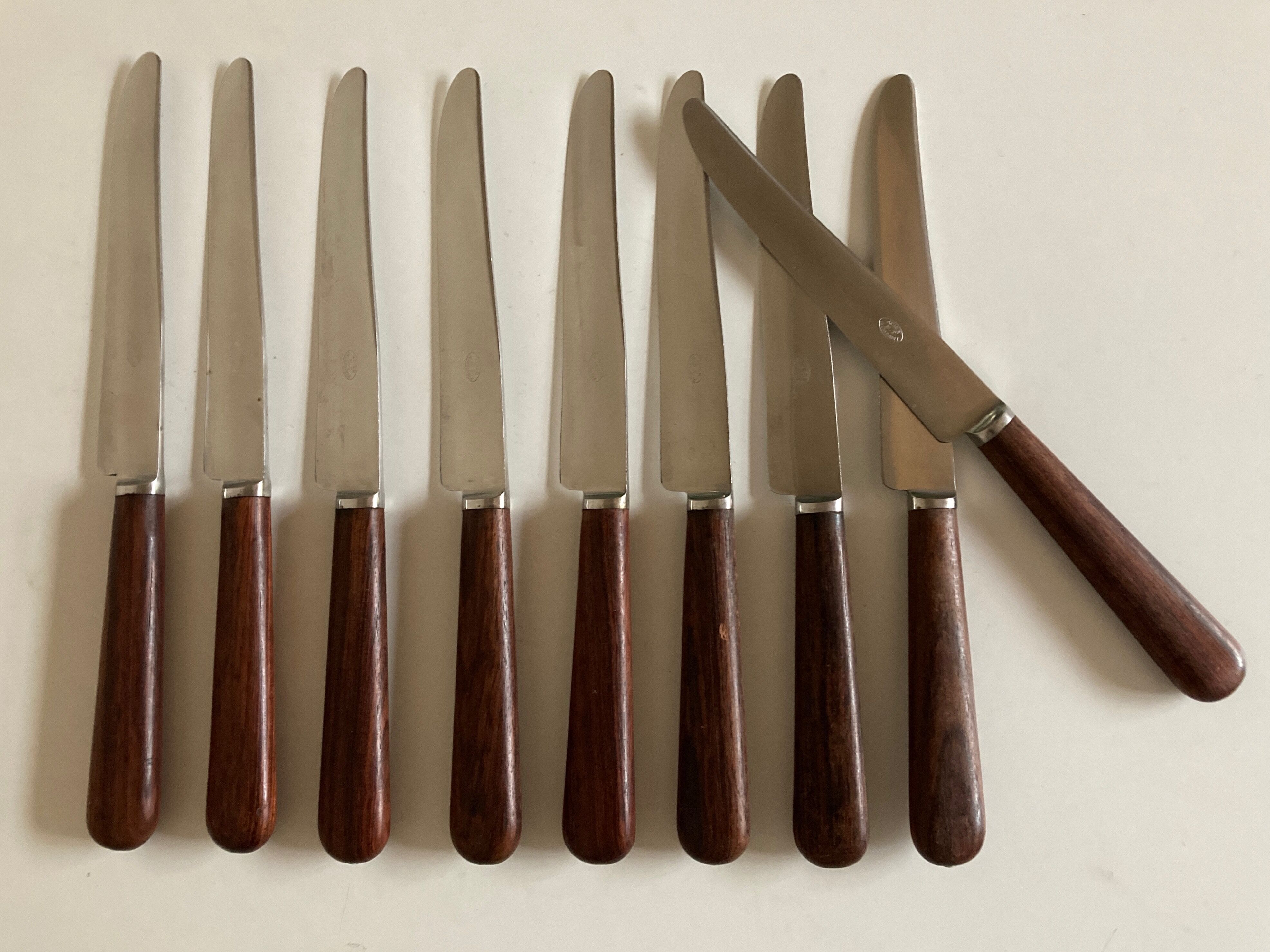Set of 9 knives with mid century rosewood handle