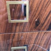 Lacquered 3-drawer chest with rosewood veneer.