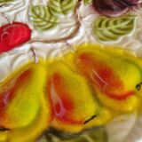 Large vintage earthenware dish with a fruit pattern.