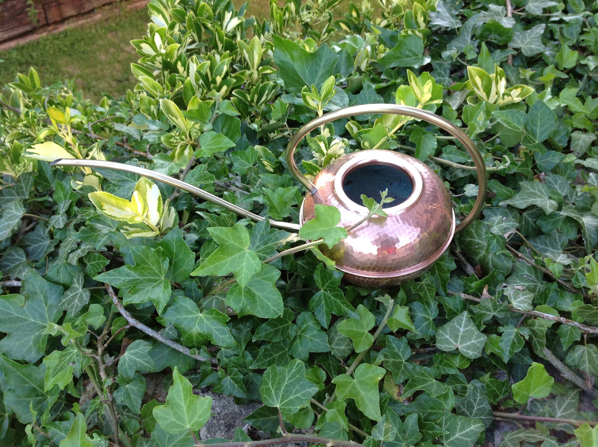 Red copper watering can in Scandinavian style 60s-70s