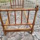 Child's bed or vintage rest bed made of solid cherry wood in a bamboo style.