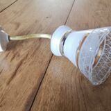 Apply brass swan collar and glass graphic patterns