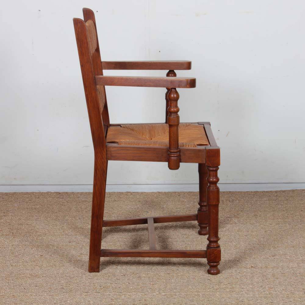 Pair of oak straw-seated armchairs from the 1950s.