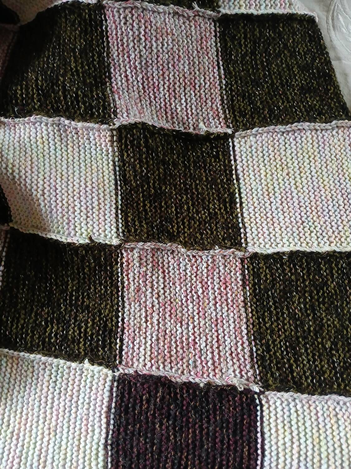 Hand-knitted patchwork plaid