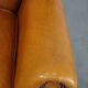 Cow leather wingback chair finished with decorative nails