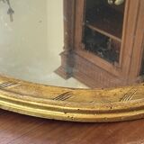 Miroir en bois doré patiné 58cm