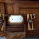 Vintage Art Deco wall coat rack in two-tone wood with engraved mirror.