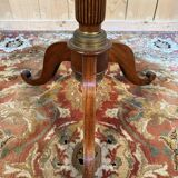 Tripod table with a sculpted top