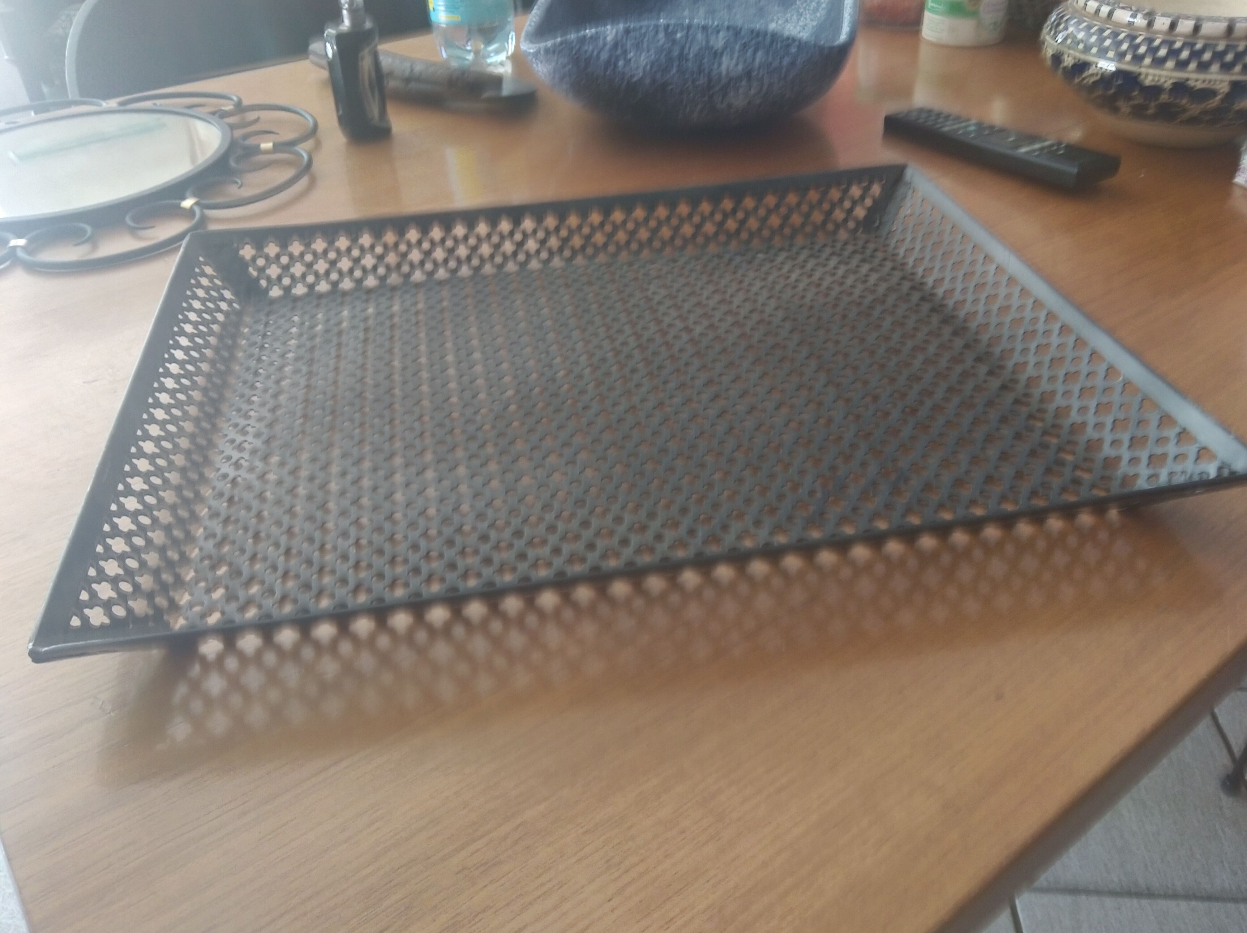 Perforated sheet metal tray, circa 1950
