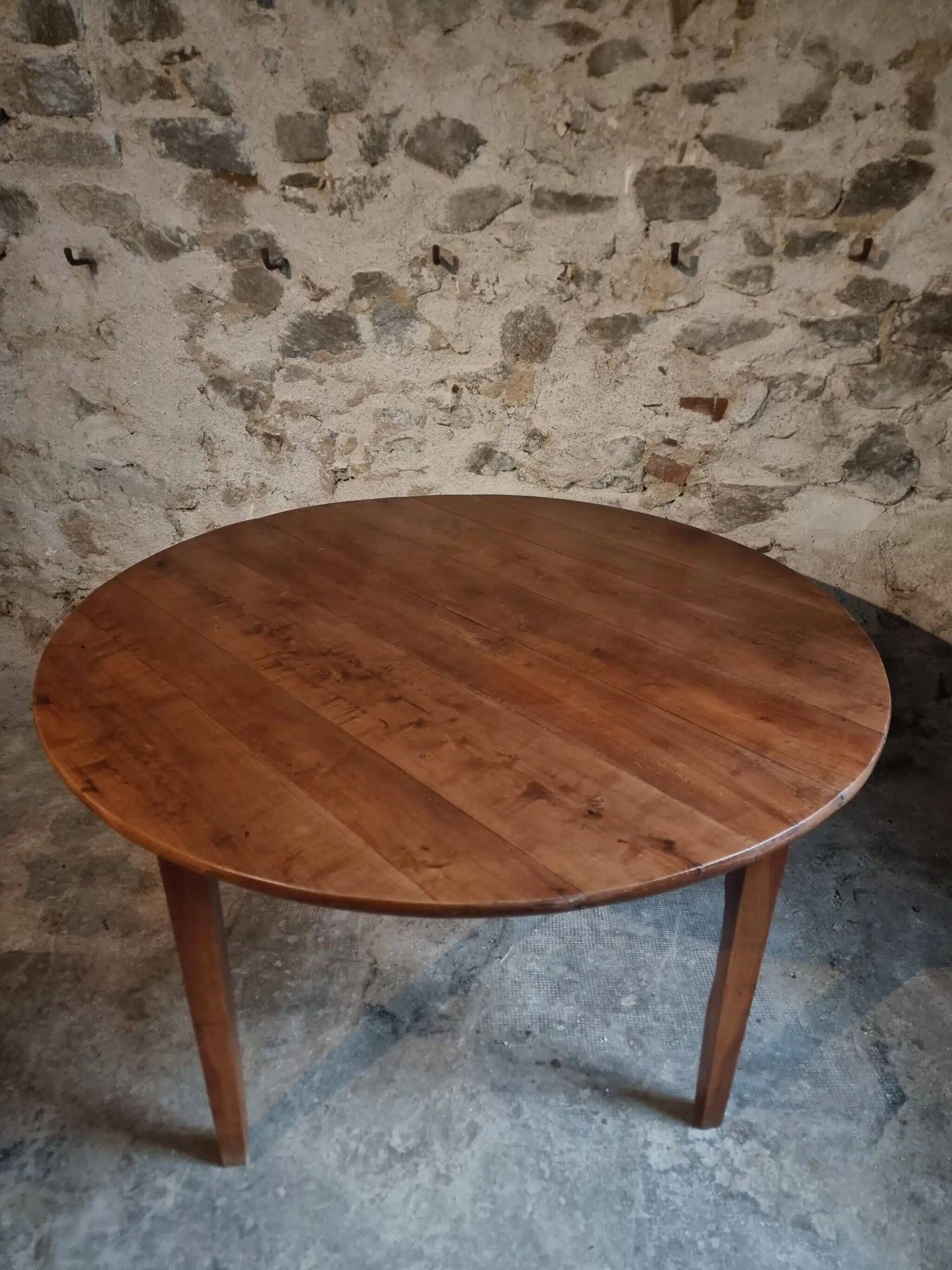 Antique round dining table in cherry wood, France, circa 1920.