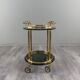 Rolling serving table in gold metal and smoked glass, 20th century