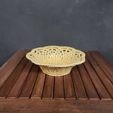 Yellow openwork woven earthenware basket