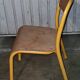 Pair of school chairs, wood and yellow metal, industrial decor.