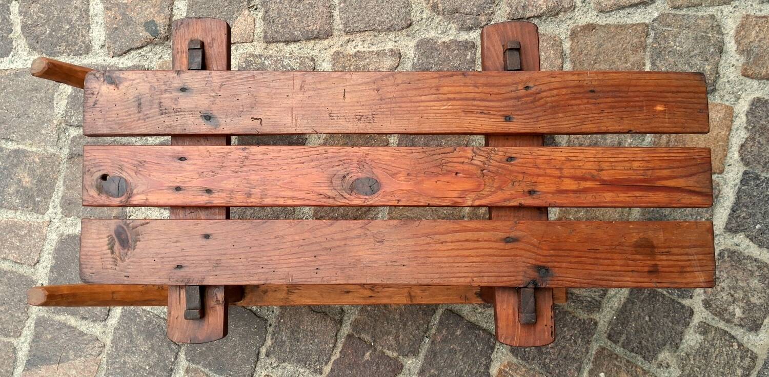 Rustic bench, old folk art, snow sled, Alps.