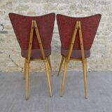 Pair of wooden chairs and red skai, 50s