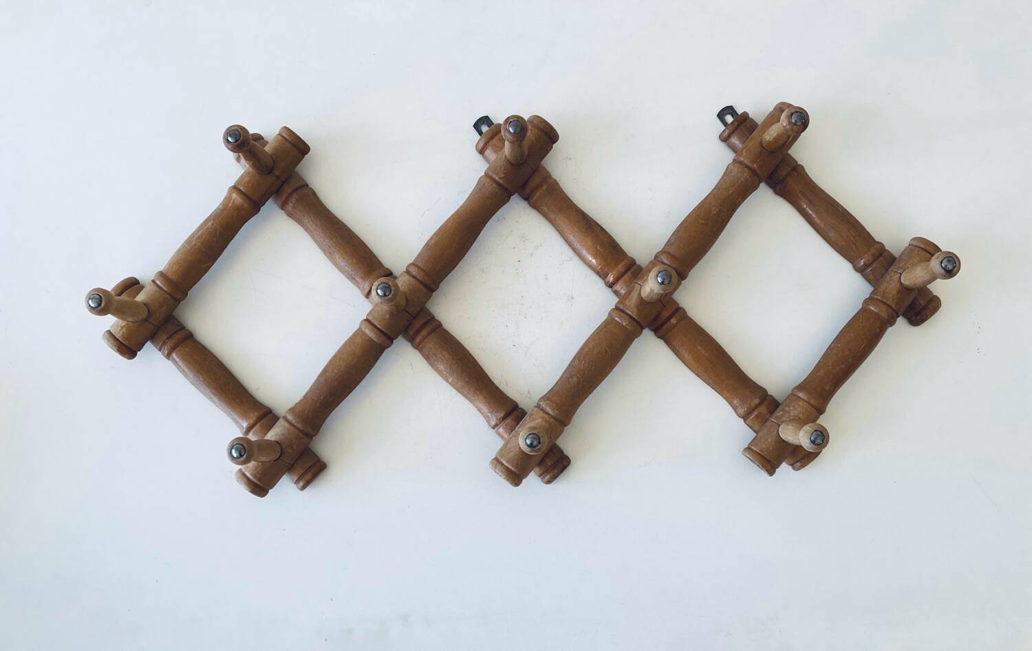 Old wooden wall coat rack