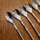 6 long silver-plated metal spoons