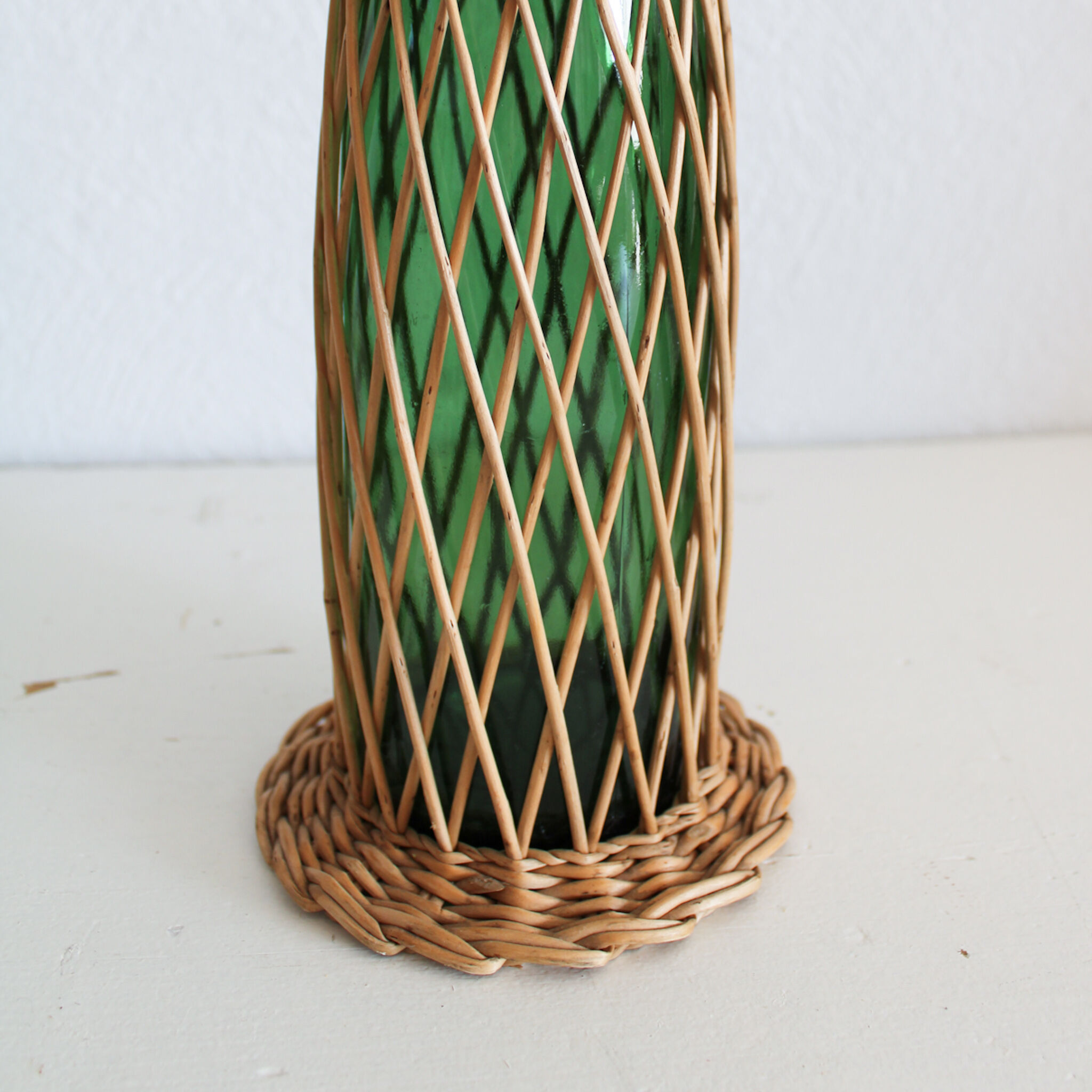 Glass and wicker bottle