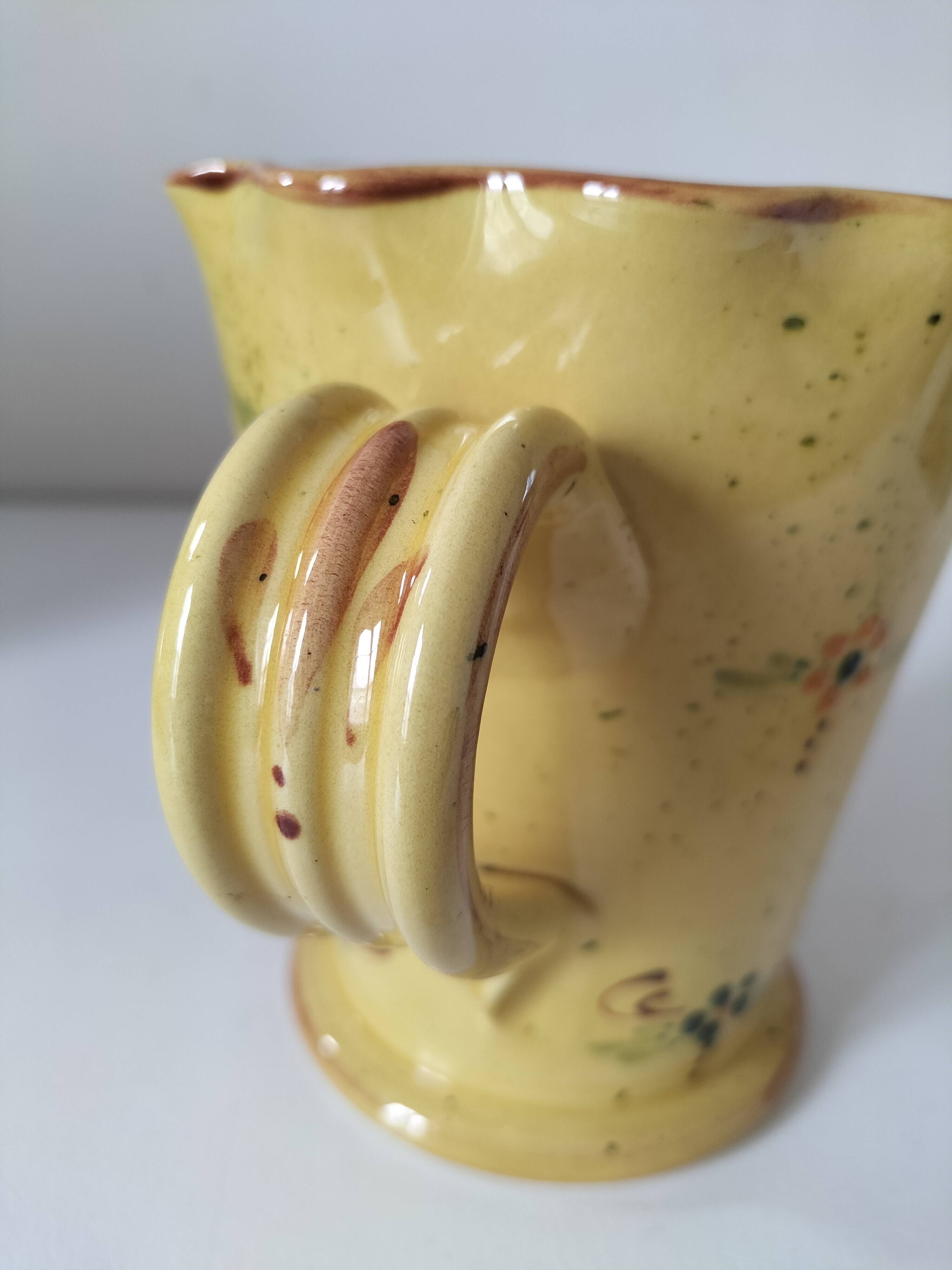 JP Daniel handmade earthenware pitcher – floral decoration on a yellow background
