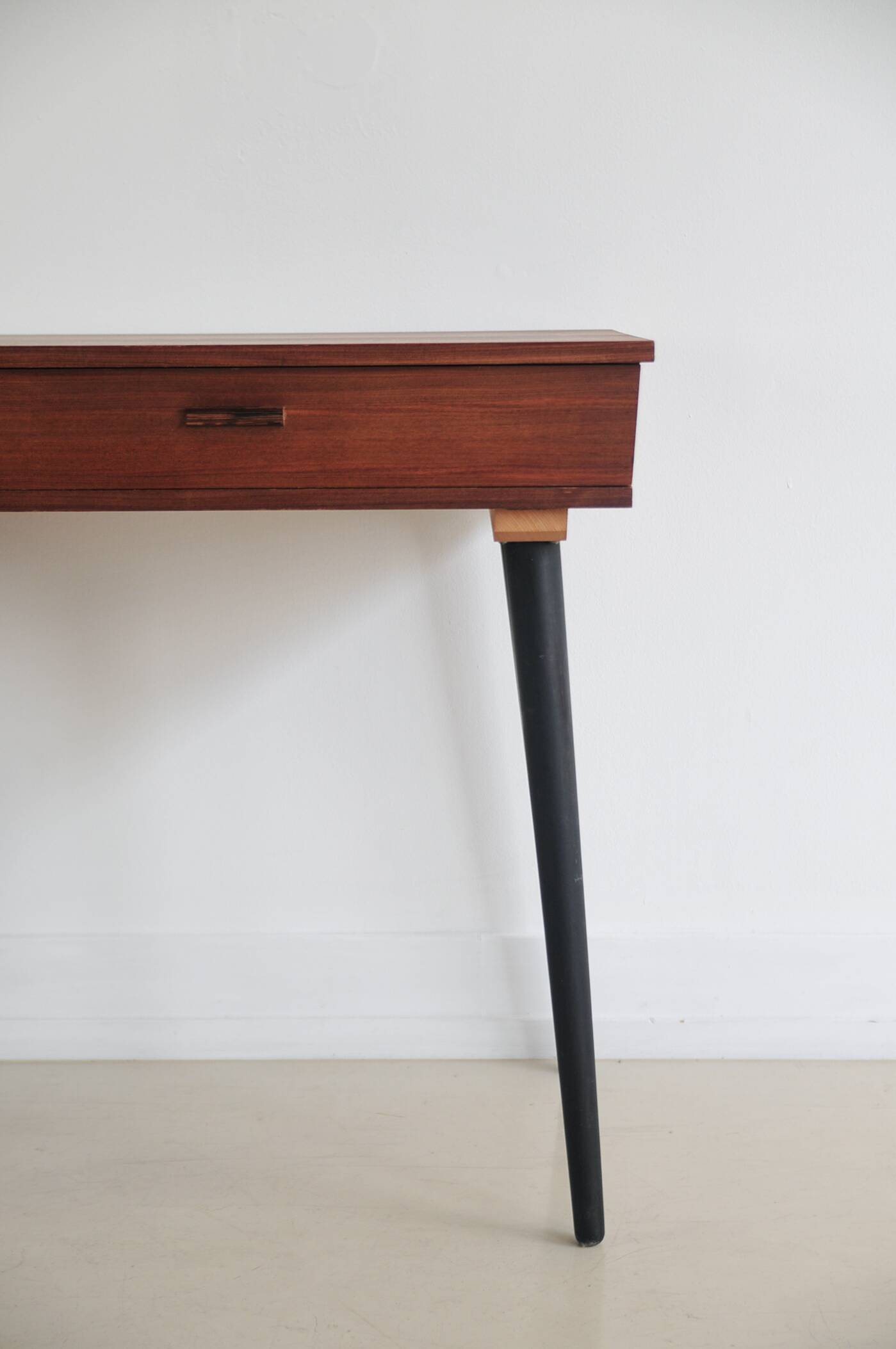 Vintage teak desk on black legs