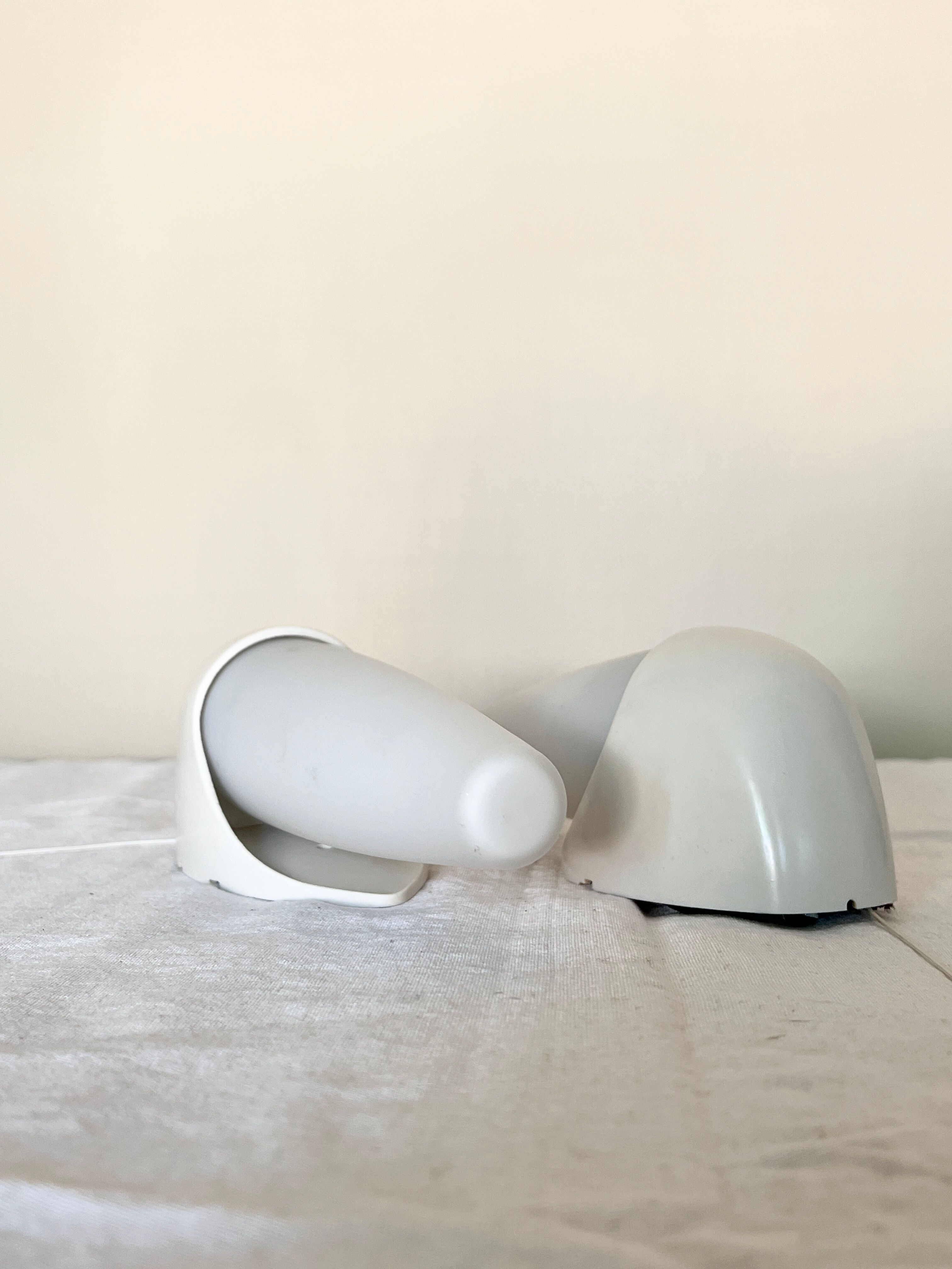 Set of two Small mid-century bakelite & glass wall lamps by Bo Niko Belgium, 1960s