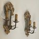 Pair of wall sconces in carved wood and silvered and gilded patinated metal with a central mirror.