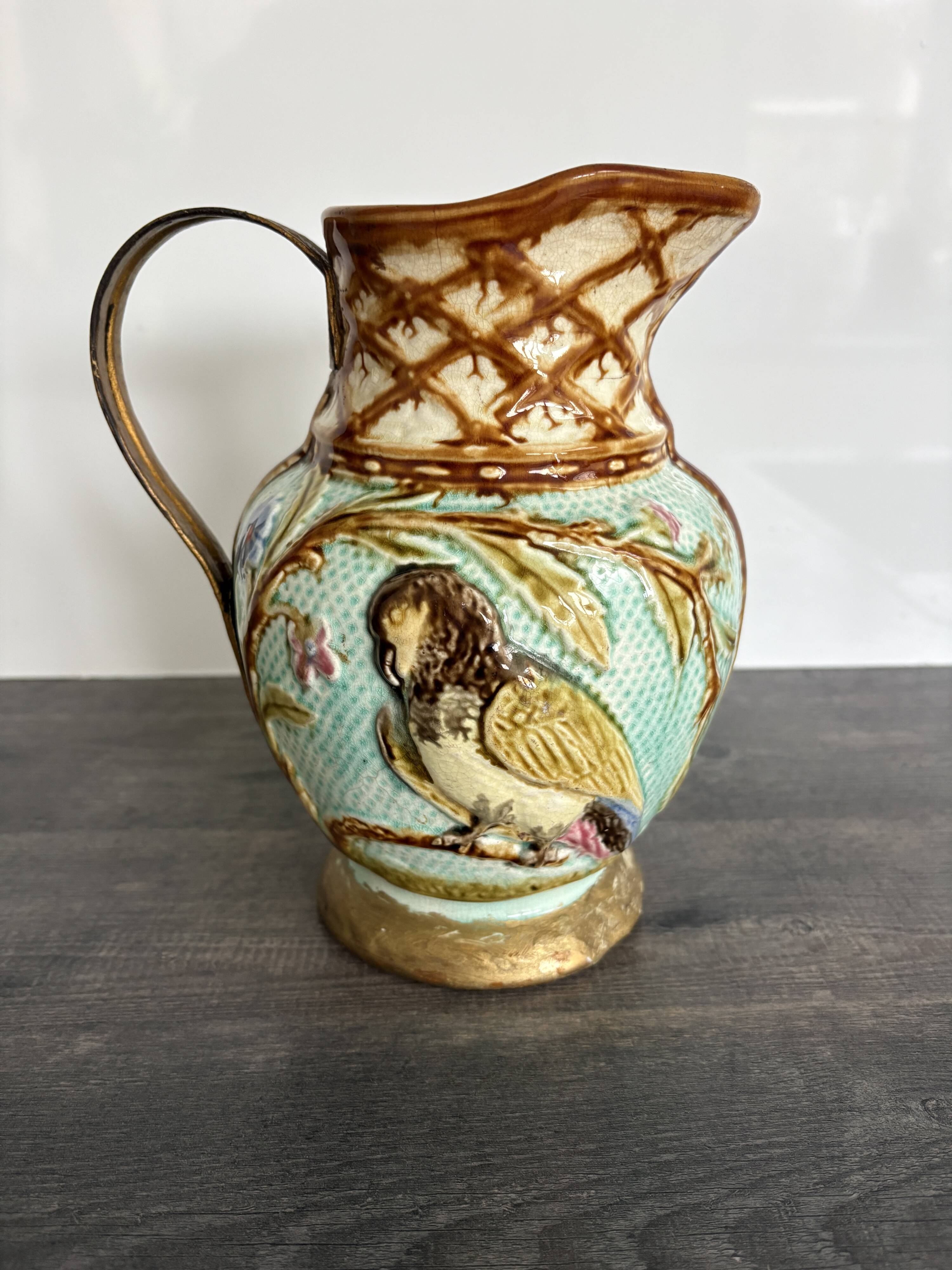 Pichet barbotine 19th century with bird decoration.