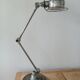 Jieldé lamp with 2 articulated metal arms, industrial style.