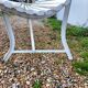 Old garden bench with metal legs and wooden slats