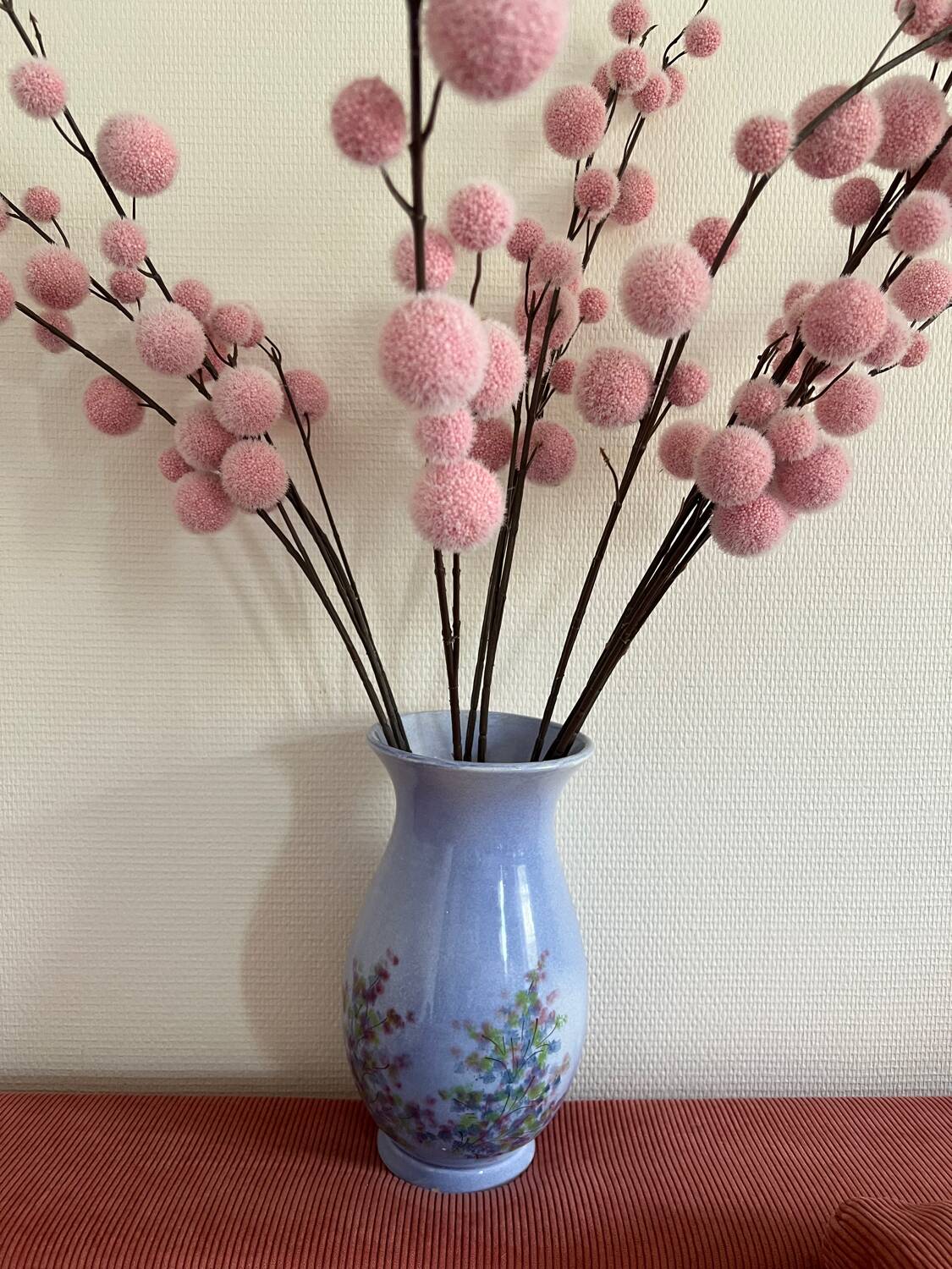 Large blue vase with pastel flowers