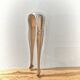 Antique sugar tongs in silvered metal