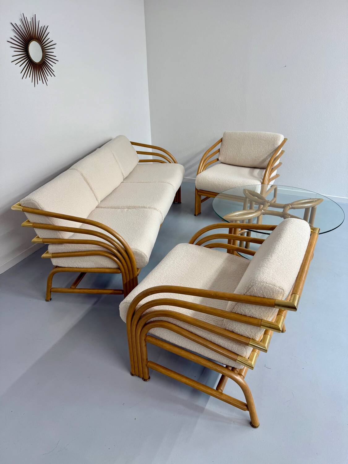 Complete living room with rattan sofa and white bouclette, brass finish, 80's design